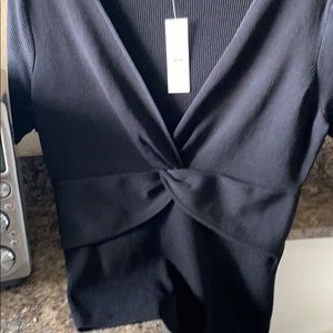 Short sleeve knit sweater. Vneck twist front. New